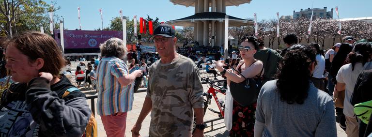 Disgusted looking white folks navigating a crowd