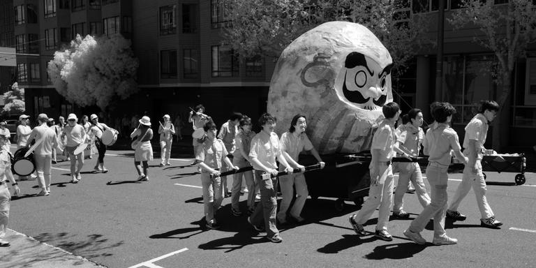 Black and white infrared photo of scouts marching in a parade